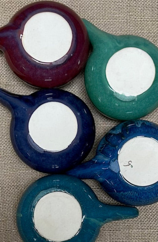 Bottom of neti pots displaying cosmetic imperfections