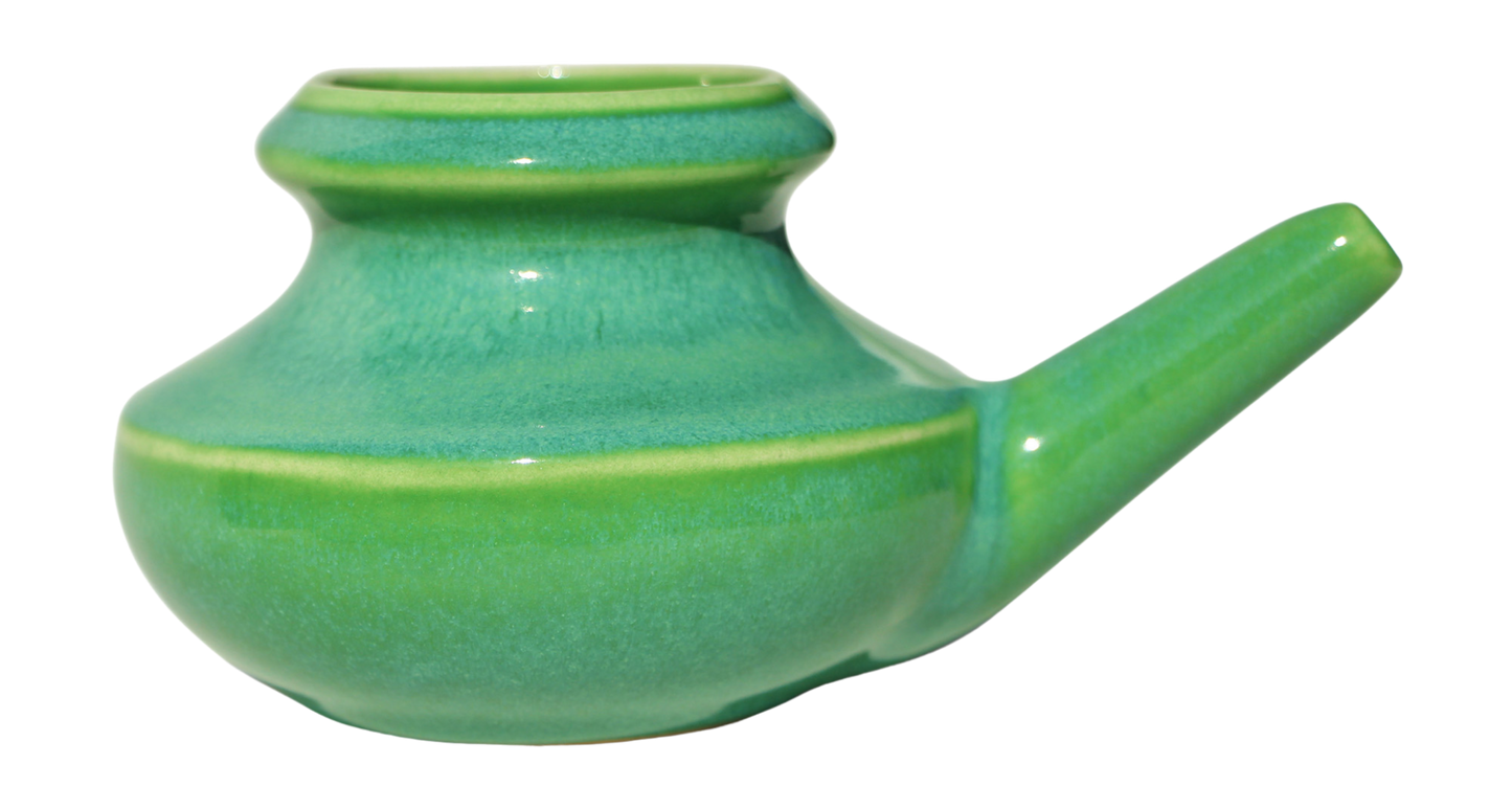 Apple Green ceramic neti pot on a white background