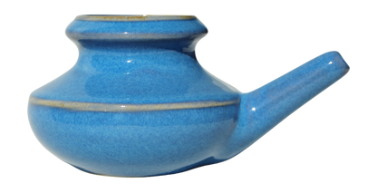 Blue ceramic neti pot on a white background
