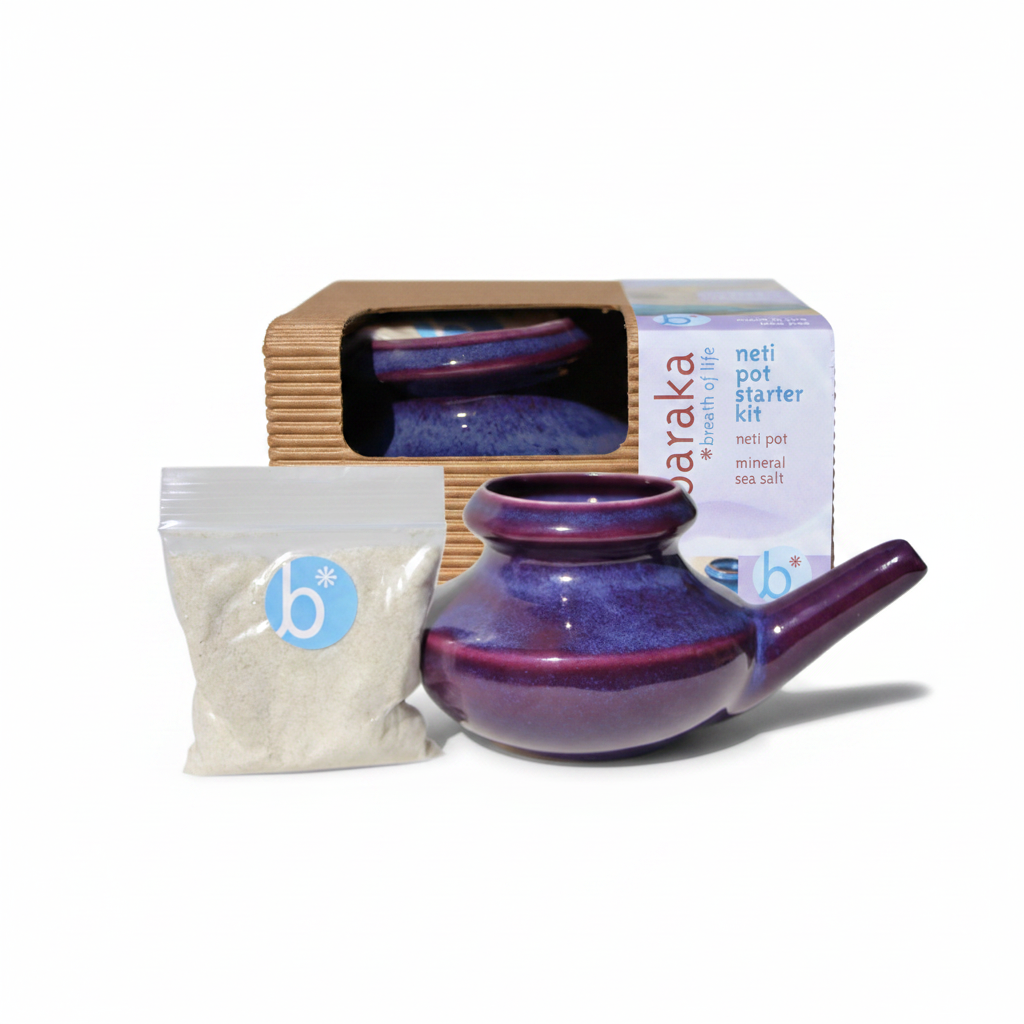 Purple neti pot and a bag of 2oz Sea Salt with cardboard packaging in the background