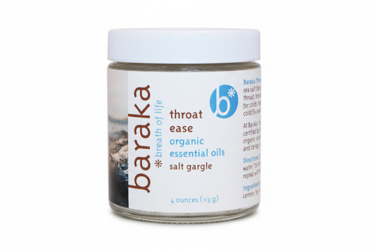 Glass jar with white plastic lid labeled Baraka Throat Ease Salt Gargle on a white background